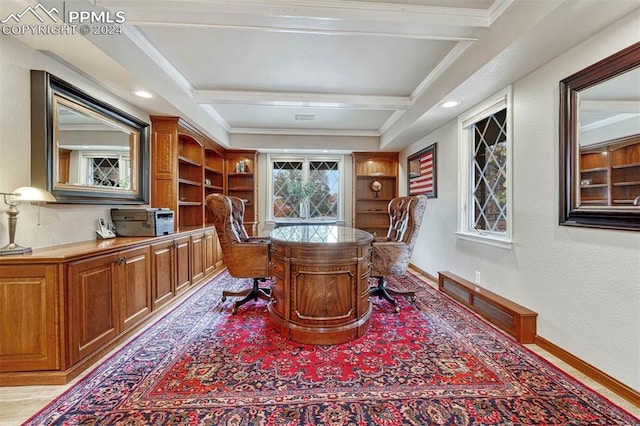 office area featuring beamed ceiling, ornamental molding, and light wood-type flooring