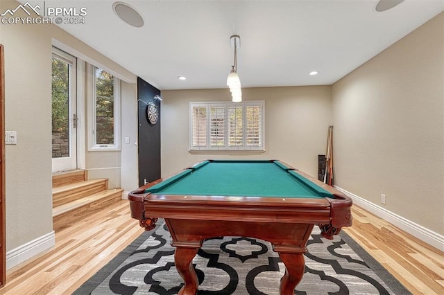 game room with pool table and light hardwood / wood-style floors