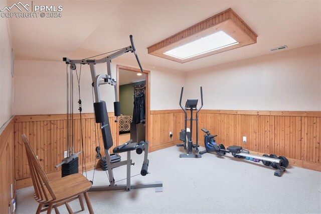 workout area featuring wooden walls