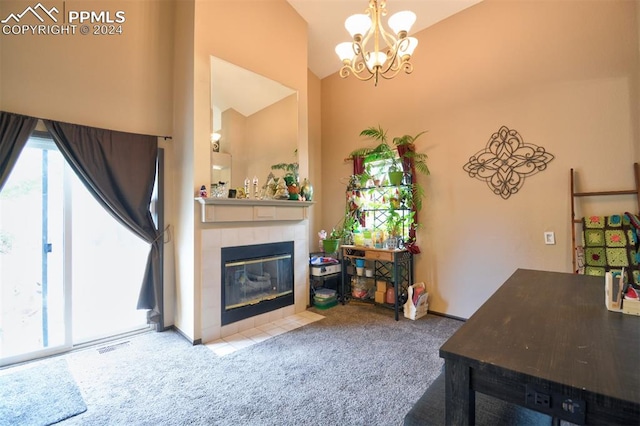 living room with a tiled fireplace, carpet floors, a chandelier, and high vaulted ceiling