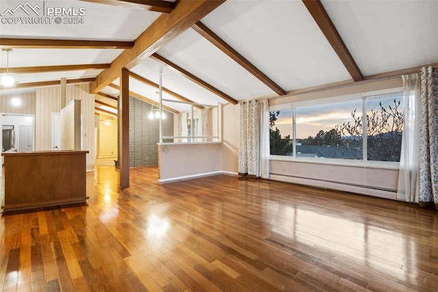 unfurnished living room featuring lofted ceiling with beams, a baseboard radiator, and hardwood / wood-style floors