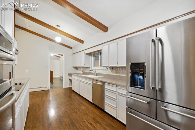 kitchen featuring vaulted ceiling with beams, dark hardwood / wood-style floors, decorative light fixtures, white cabinetry, and appliances with stainless steel finishes