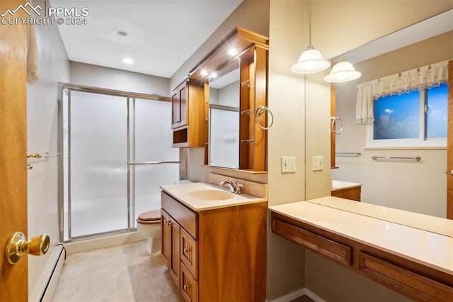 bathroom featuring toilet, walk in shower, vanity, and baseboard heating