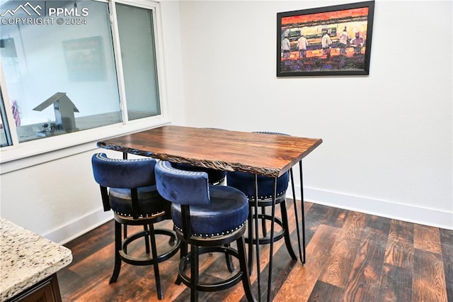 dining room with dark wood-type flooring