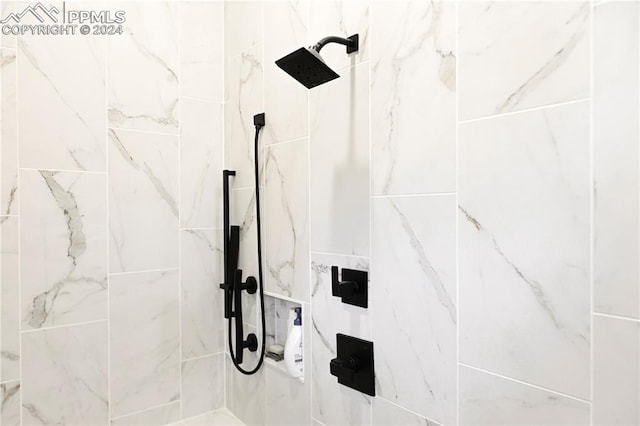 bathroom with a tile shower