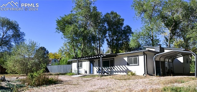 view of front of property with a carport