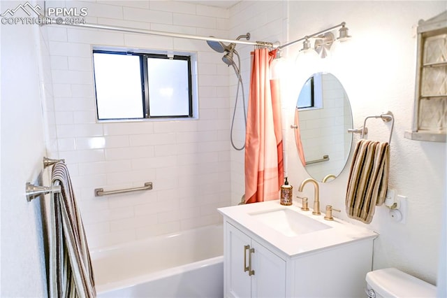 full bathroom featuring shower / bath combo with shower curtain, vanity, and toilet