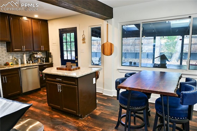 kitchen featuring dark wood-type flooring, dishwasher, decorative backsplash, light stone countertops, and dark brown cabinets