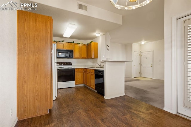 kitchen with kitchen peninsula, black appliances, sink, a notable chandelier, and dark carpet