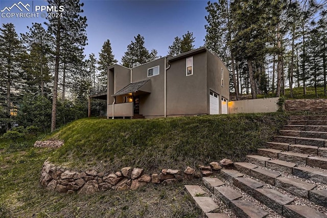 view of side of home with a garage