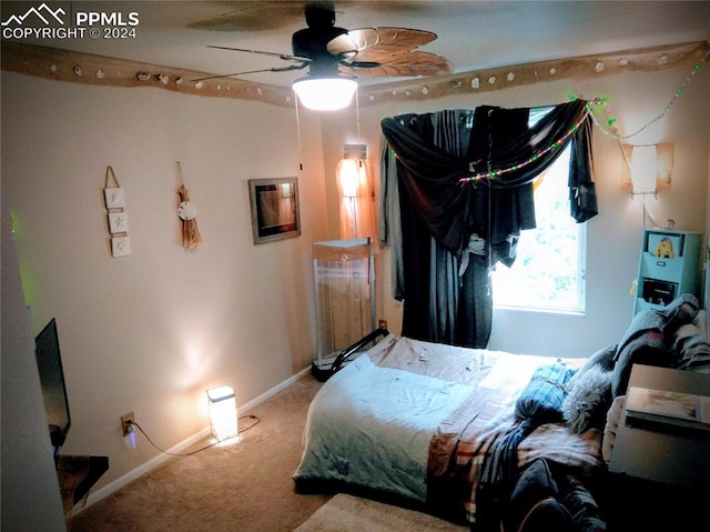 bedroom with ceiling fan and carpet floors