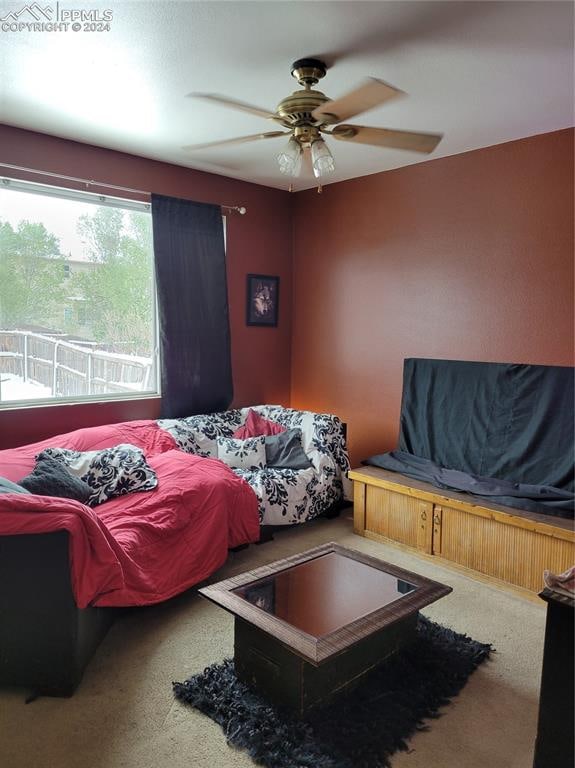 carpeted bedroom featuring ceiling fan