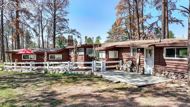 rear view of property featuring a patio