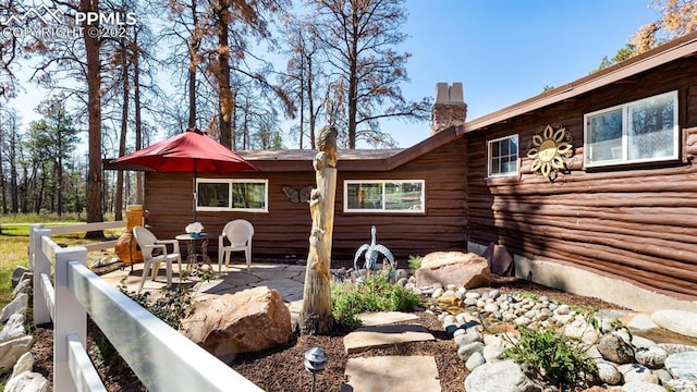 rear view of house with a patio