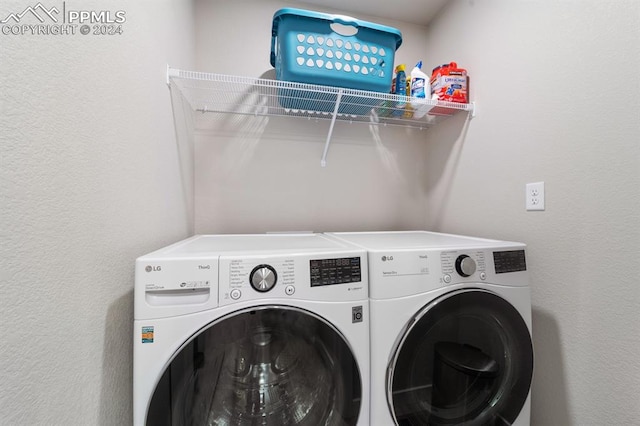 clothes washing area featuring independent washer and dryer