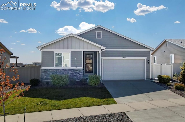 view of front facade featuring a garage and a front lawn