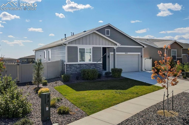 craftsman-style house with a garage and a front yard