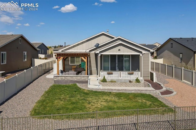 view of front of home with central AC and a front lawn