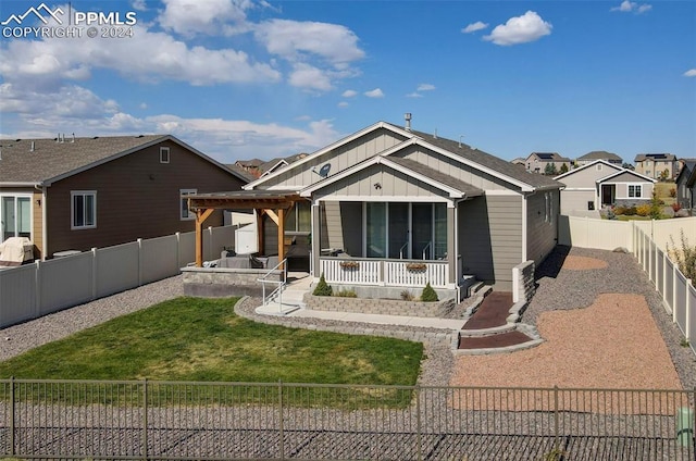 view of front of house with a front lawn and a patio area