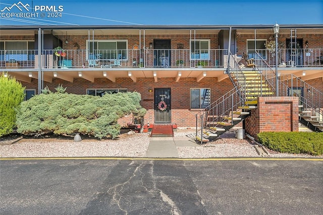 view of front of home with a balcony