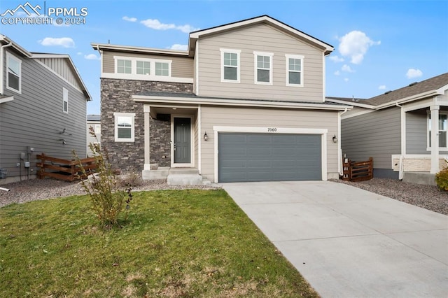 front facade featuring a garage and a front yard