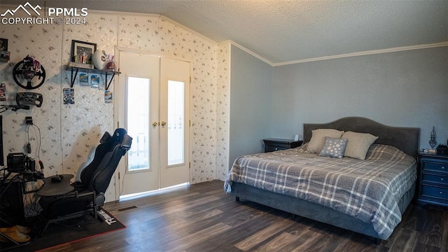 bedroom featuring dark wood-type flooring, crown molding, a textured ceiling, and lofted ceiling