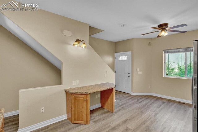 foyer featuring ceiling fan and light hardwood / wood-style flooring