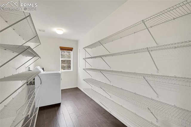 washroom with washer / dryer and dark hardwood / wood-style floors