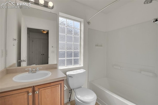 full bathroom featuring vanity, bathtub / shower combination, and toilet