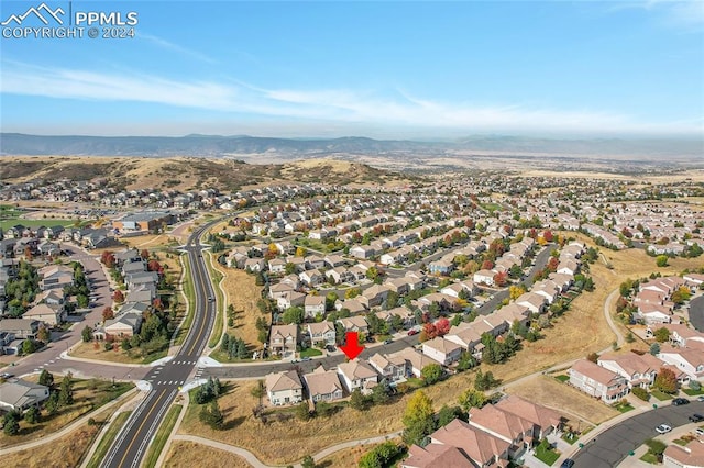 birds eye view of property featuring a mountain view