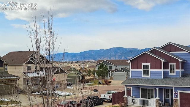 view of front of home with a mountain view and covered porch