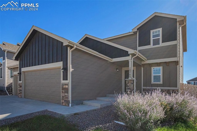 craftsman inspired home with a garage