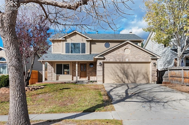 view of front of house with a garage and a front yard