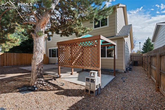 rear view of house with a patio area