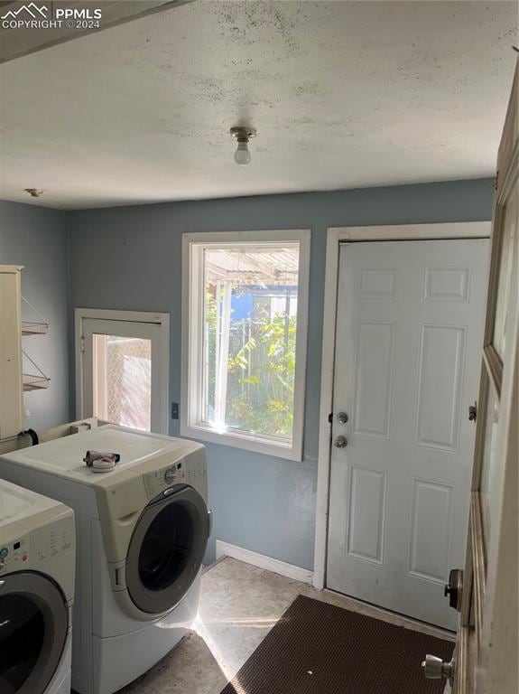 laundry area with separate washer and dryer