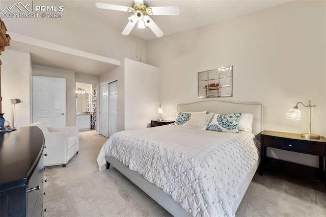 carpeted bedroom featuring ceiling fan, a closet, and connected bathroom