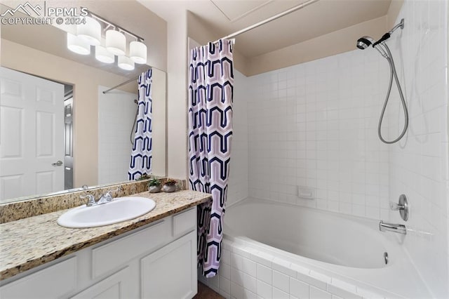 bathroom featuring vanity and shower / bath combo with shower curtain