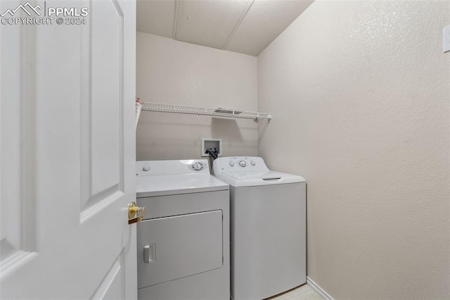 laundry area with washing machine and dryer