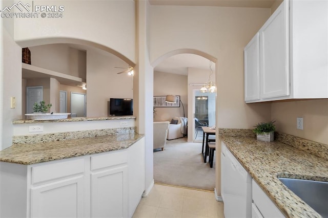 kitchen with white cabinetry, dishwasher, light colored carpet, light stone countertops, and ceiling fan with notable chandelier