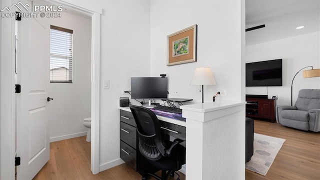 office area with hardwood / wood-style floors