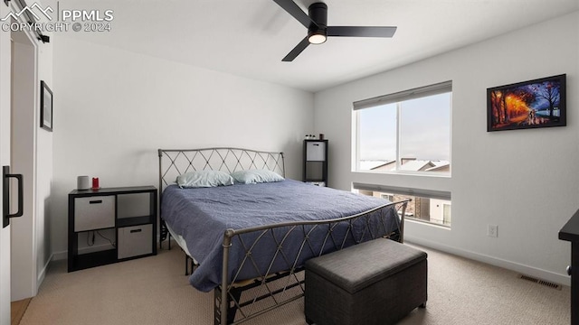 carpeted bedroom featuring ceiling fan