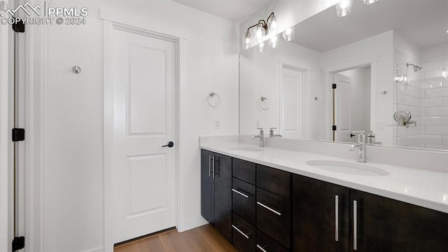 bathroom with vanity, wood-type flooring, and an enclosed shower