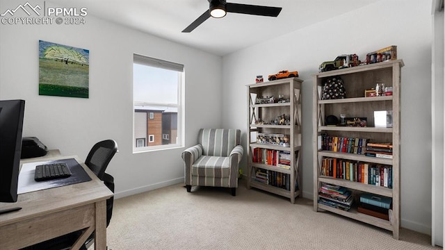 home office with light carpet and ceiling fan