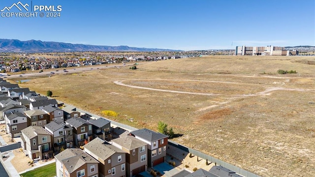 birds eye view of property featuring a mountain view