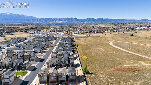 birds eye view of property with a mountain view