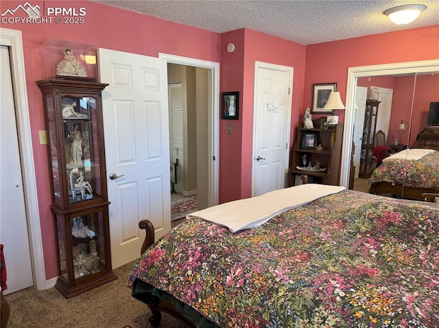 carpeted bedroom featuring a textured ceiling