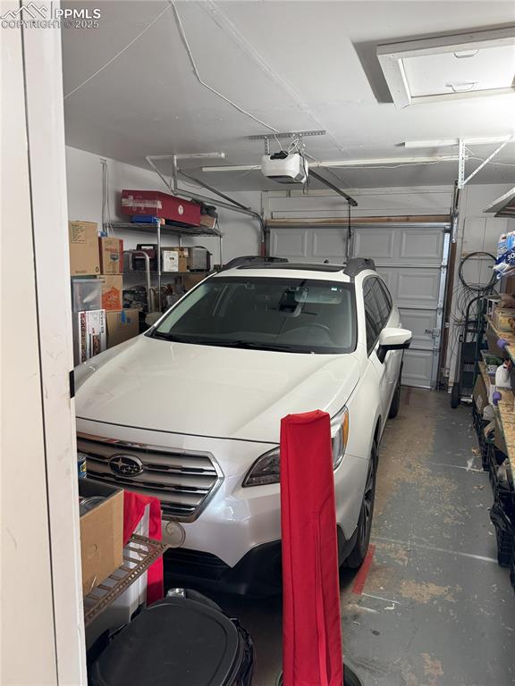 garage featuring a garage door opener