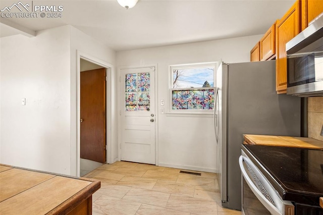 kitchen featuring electric range