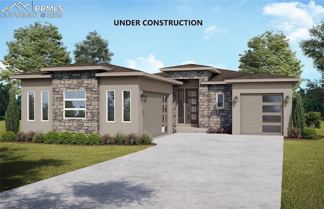 prairie-style home featuring a garage and a front lawn