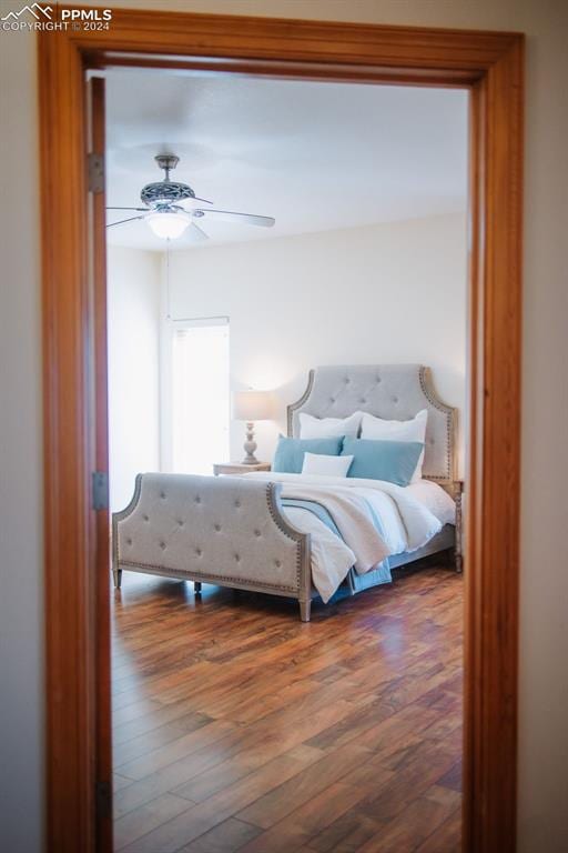 bedroom featuring ceiling fan and hardwood / wood-style floors